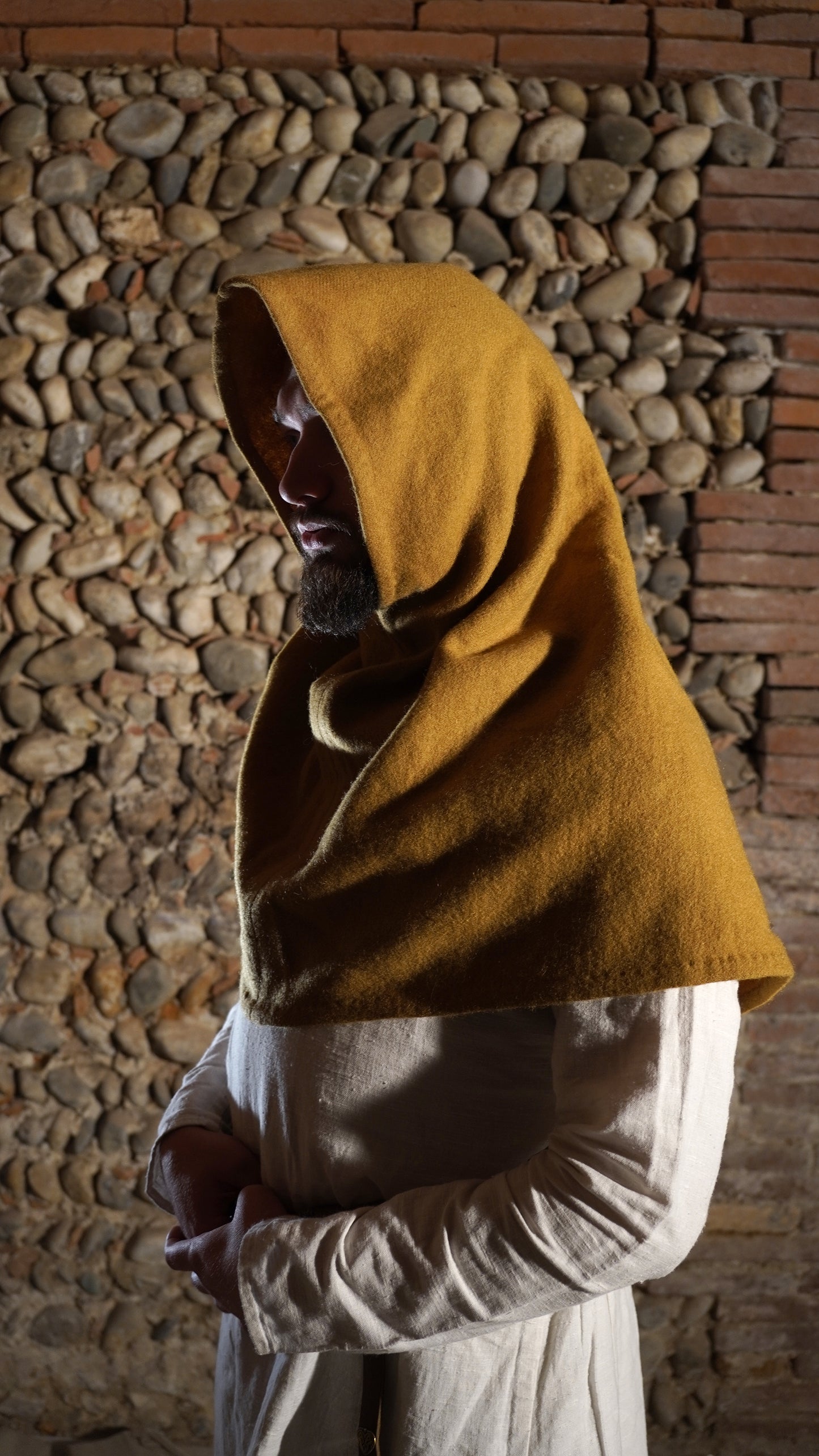 Man dressed in Roman Hood side view