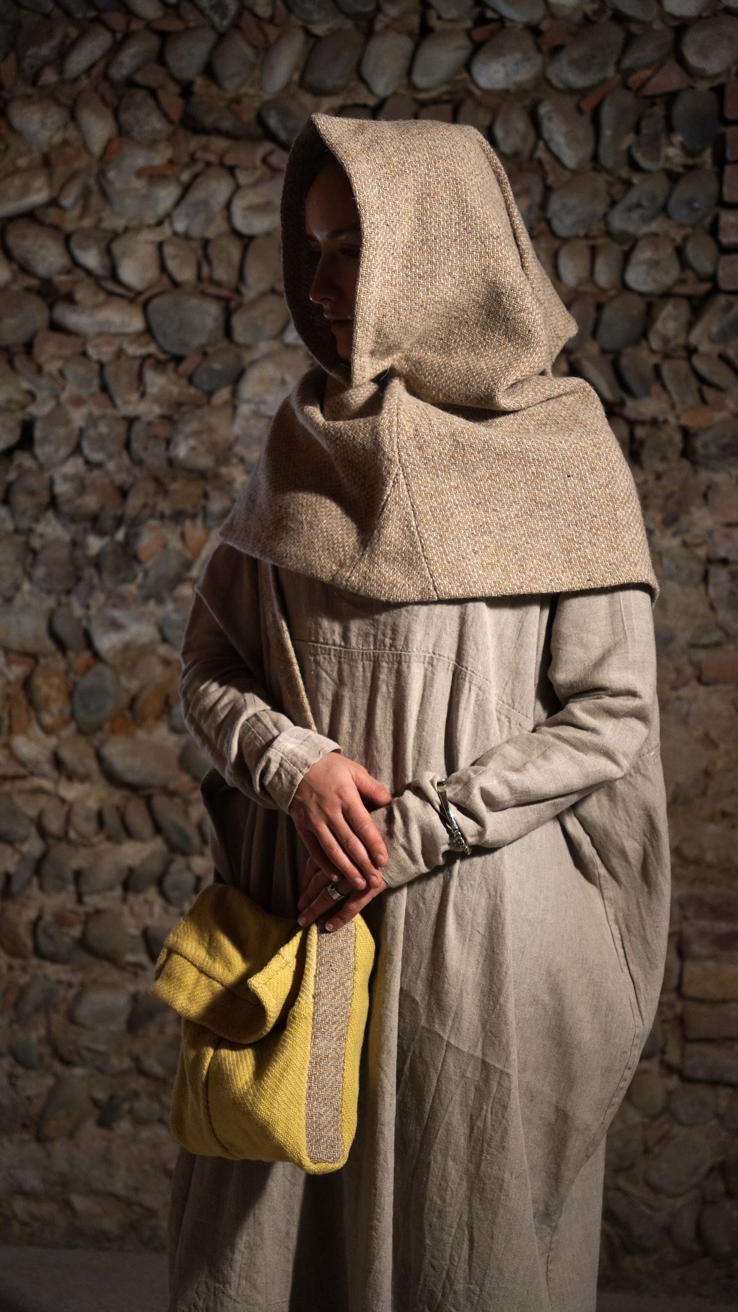 Woman wearing Greenland hood holding a bag