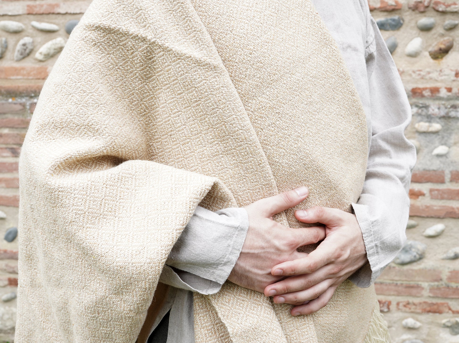 man dressed with Handwoven Diamond Twill Cloak  on tunik closeup