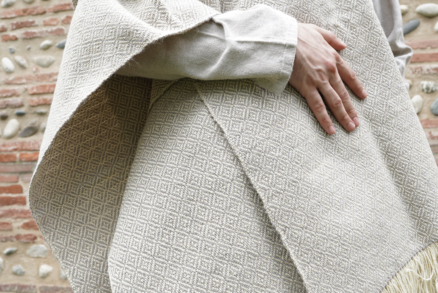 Handwoven Diamond Twill Cloak held by hand